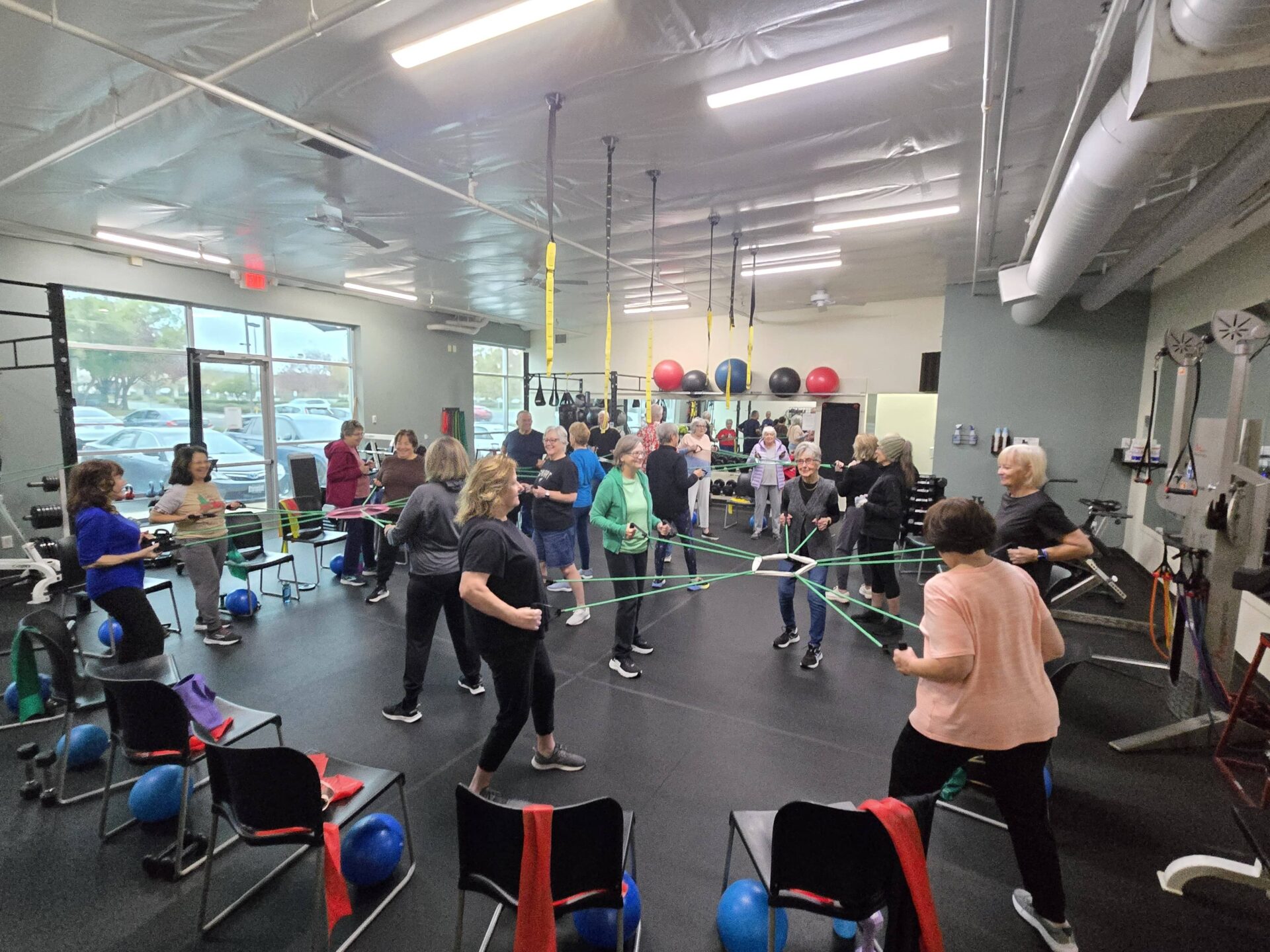 Seniors working with resistance bands in a group balance class